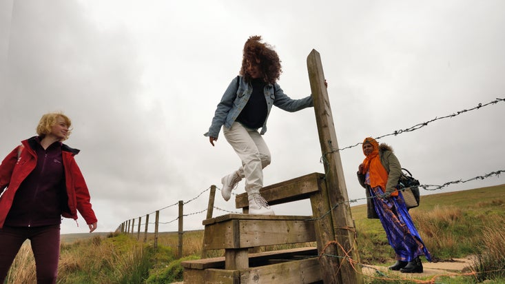 People crossing a stile at Divis and the Black Mountain, Northern Ireland